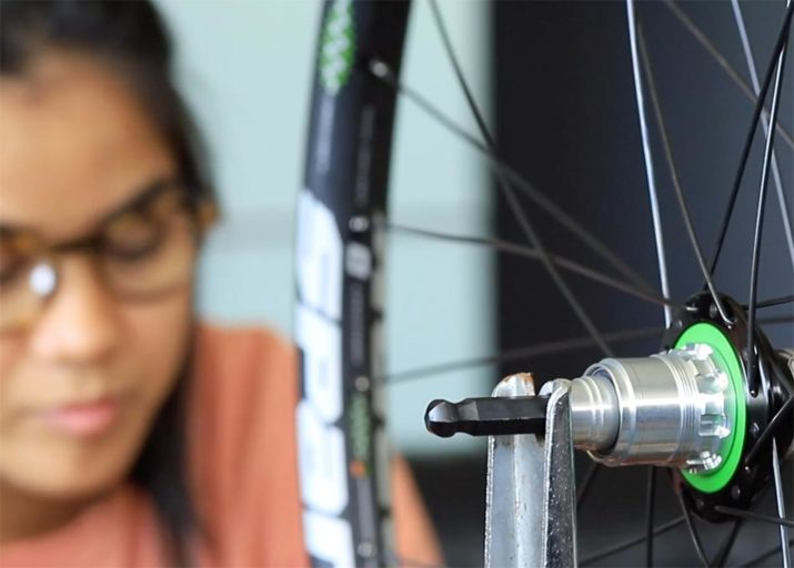 still photo from video: the art of assembling a bicycle wheel, spokes and all