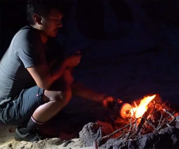 video frame: campfire, bike packing on Oahu.